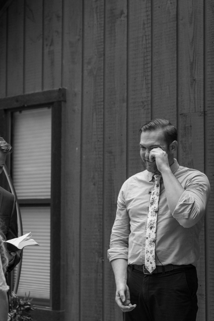 Groom emotional crying during ceremony Broken Bow elopement