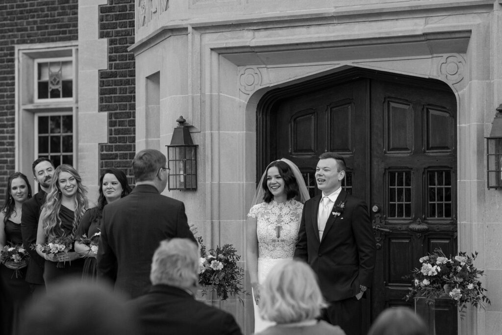 Bride and groom outdoor wedding ceremony at Harwelden Mansion