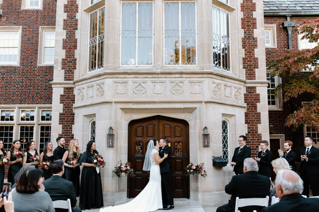 Bride and groom outdoor wedding ceremony at Harwelden Mansion