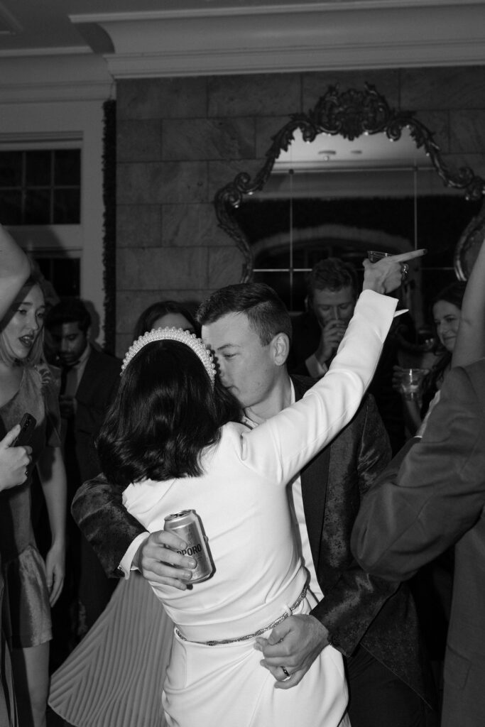 Bride and groom dancing at reception black and white photo