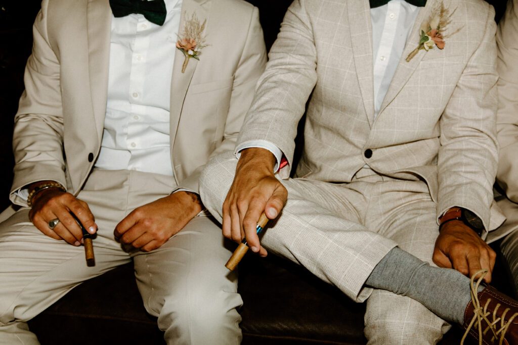 Detail shot of groomsmen attire in tan suits