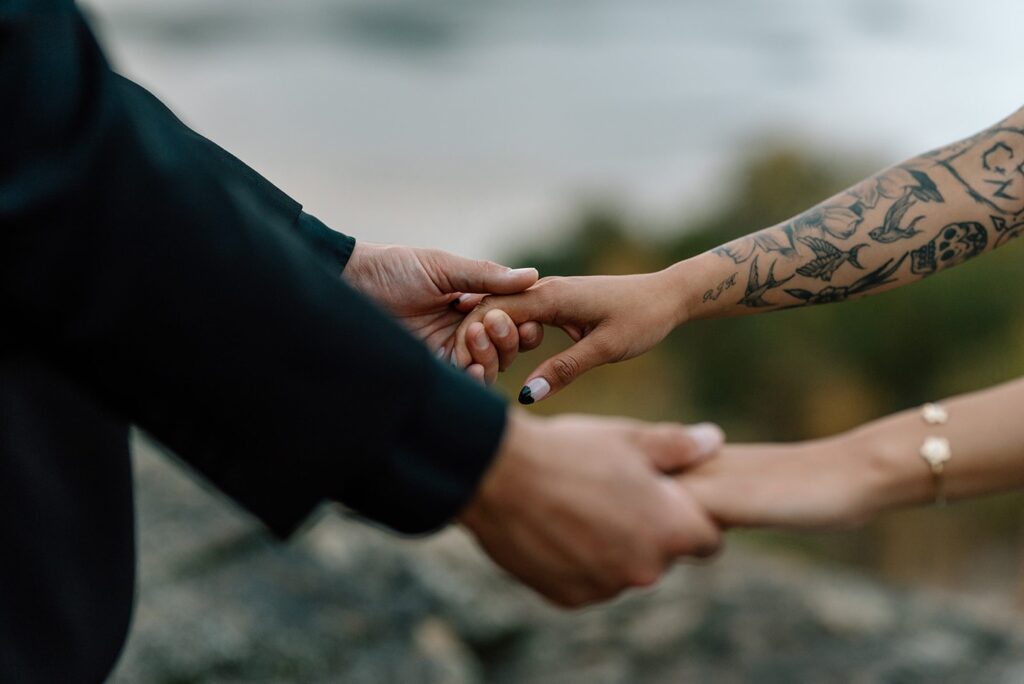 Bride and groom holding hands portrait 