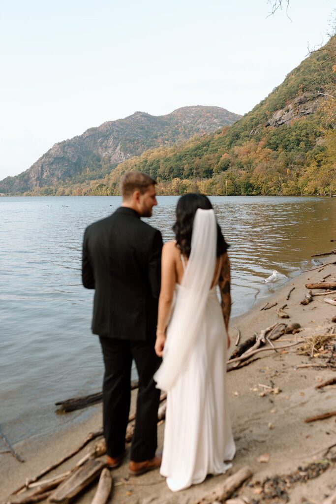 Unique elopement in the mountains of Hudson Valley bride and groom portrait on the beach