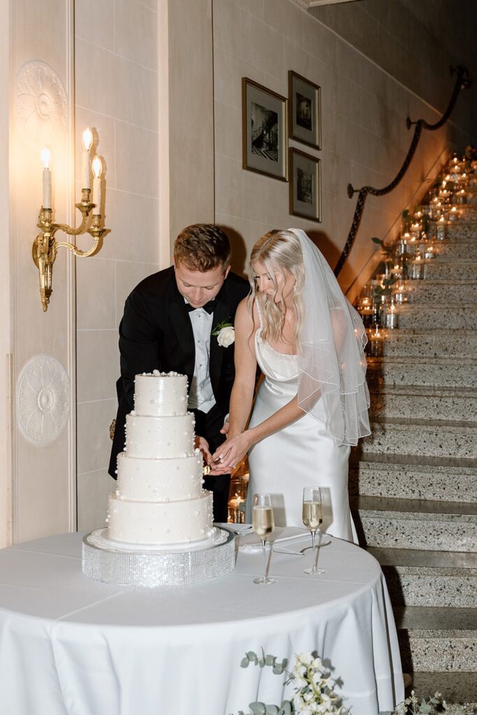 Bride and groom cutting the cake during Tulsa, Oklahoma Wedding