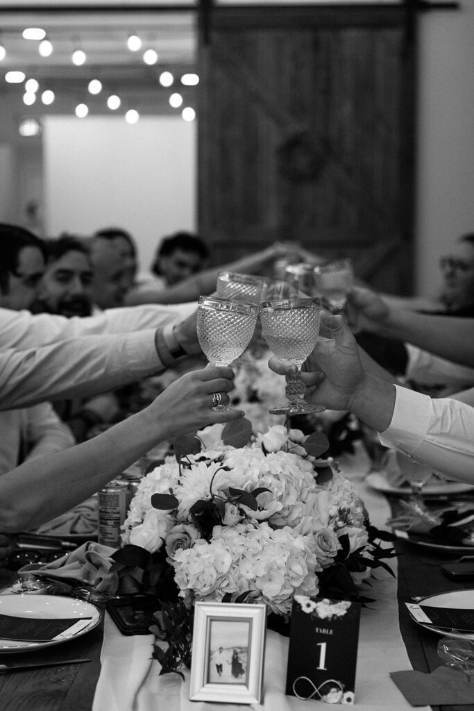 Wedding guests cheersing during wedding toasts 