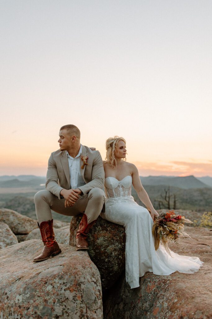 Groom with cowboy boots and bride with boho bouquet