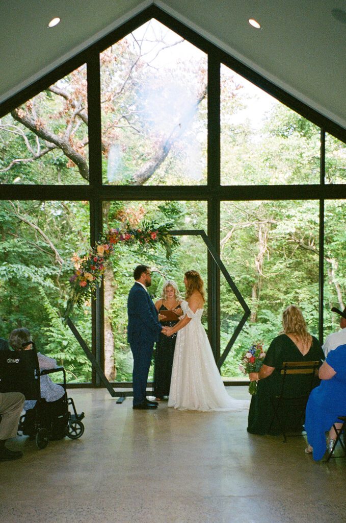 film whimsical wedding ceremony picture with hexagon ceremony arch 