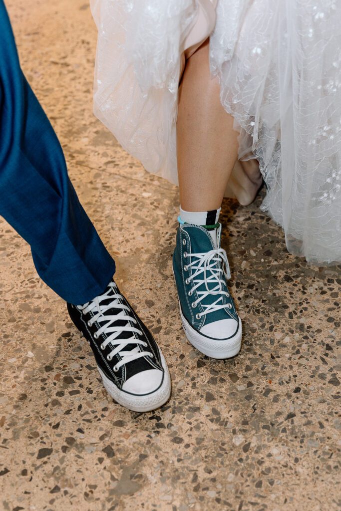 bride and groom in converse