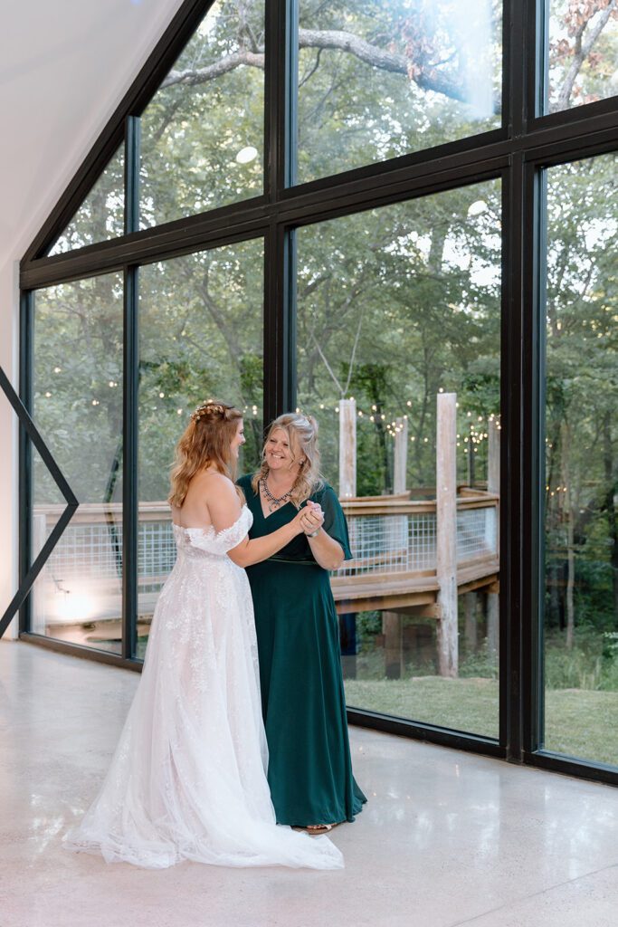 bride and mother of the bride dancing 