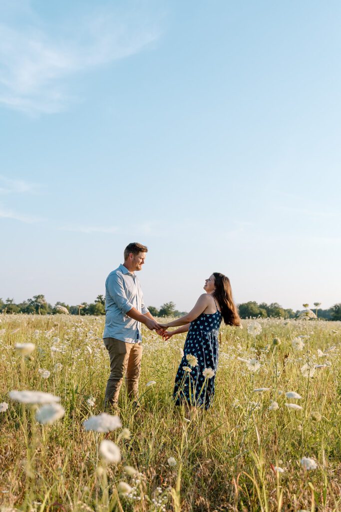 couple in wildflower field 