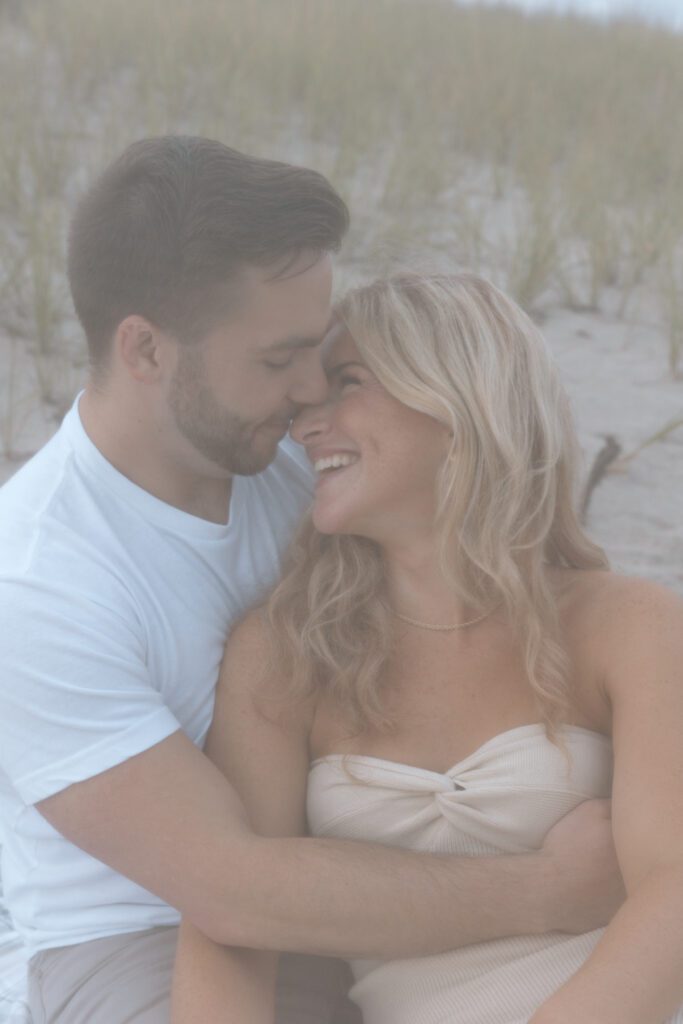 couple on beach embracing 