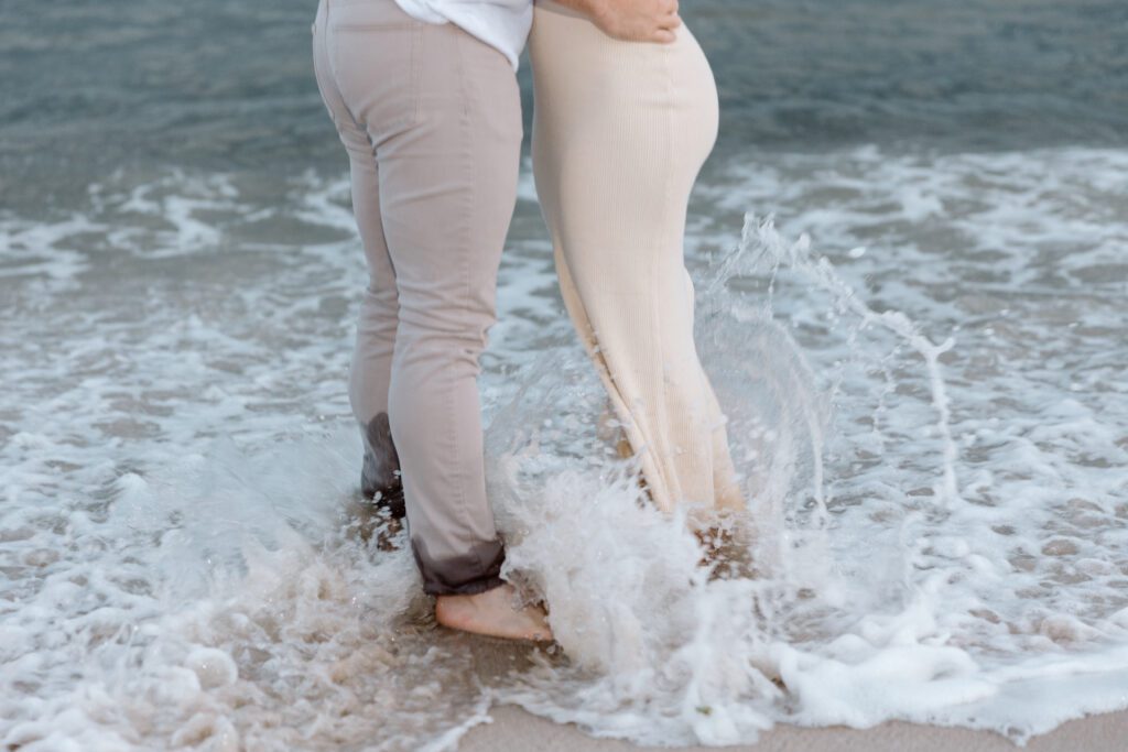 couple splashing in the water