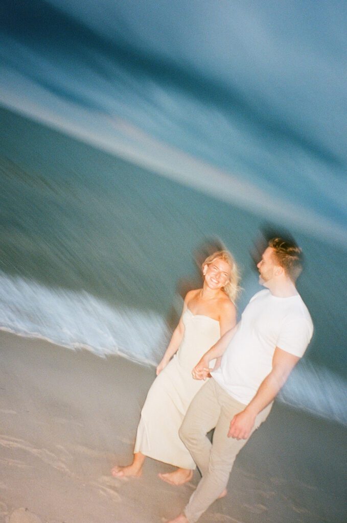 film blurry couple at beach sunset 