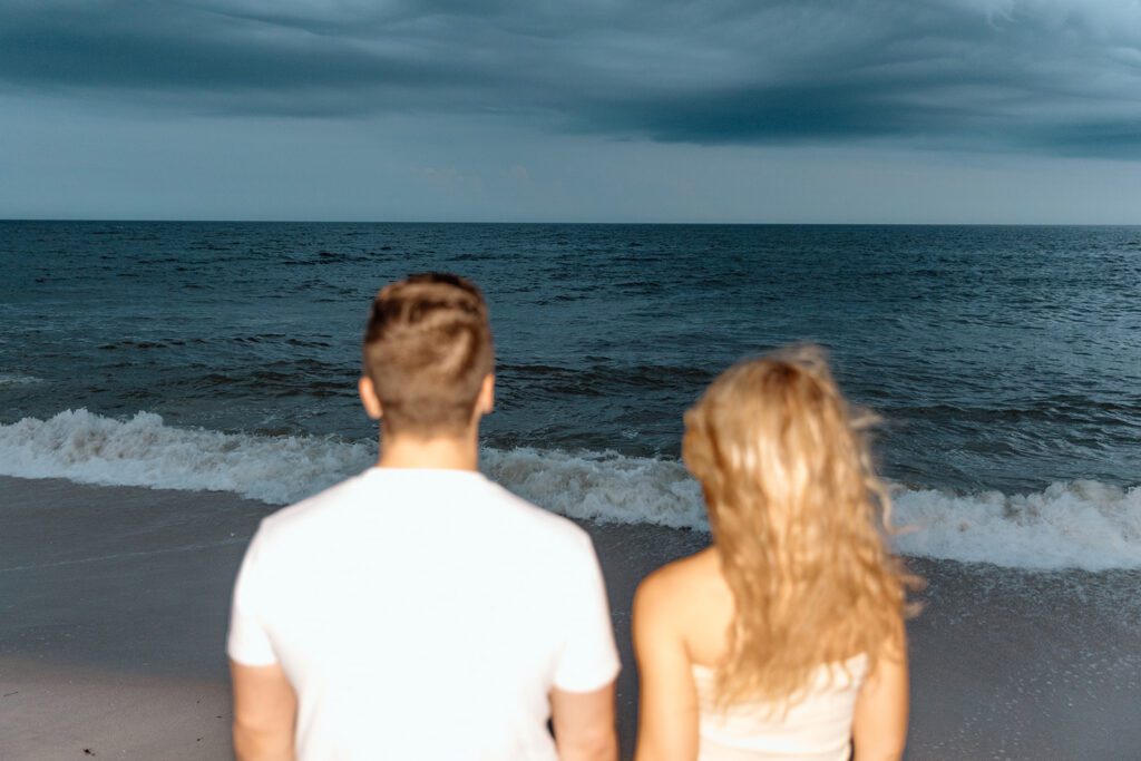 couple staring at the ocean