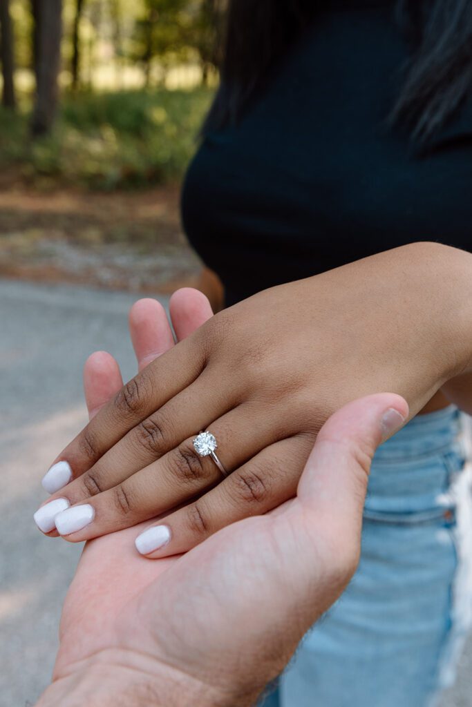 black woman hand with round solitaire 