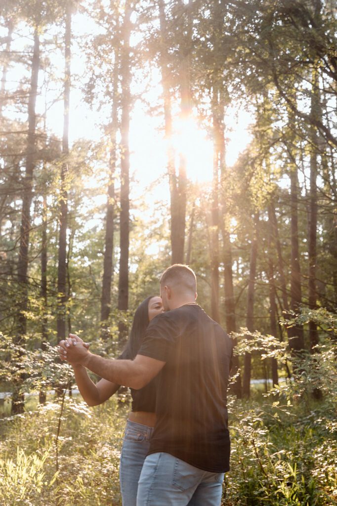 couple dances in forest 