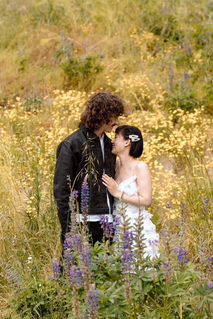 couple laughing together at engagement session at olympic national park 