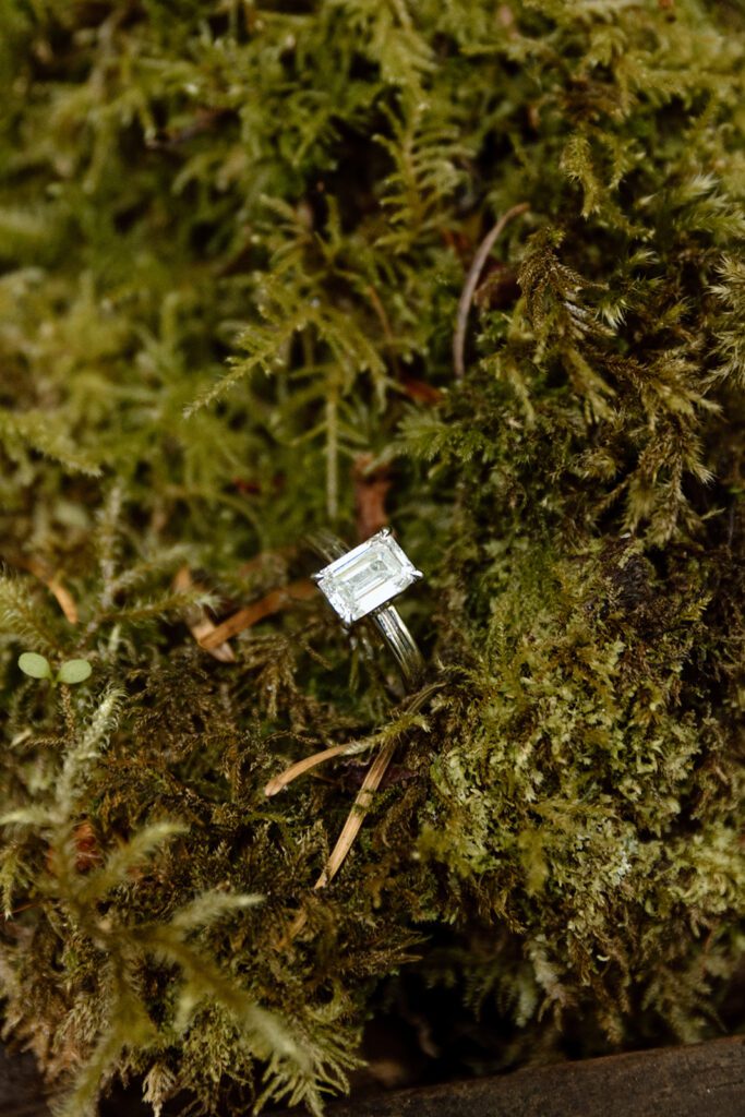 emerald cut white gold silver engagement ring in ferns and moss