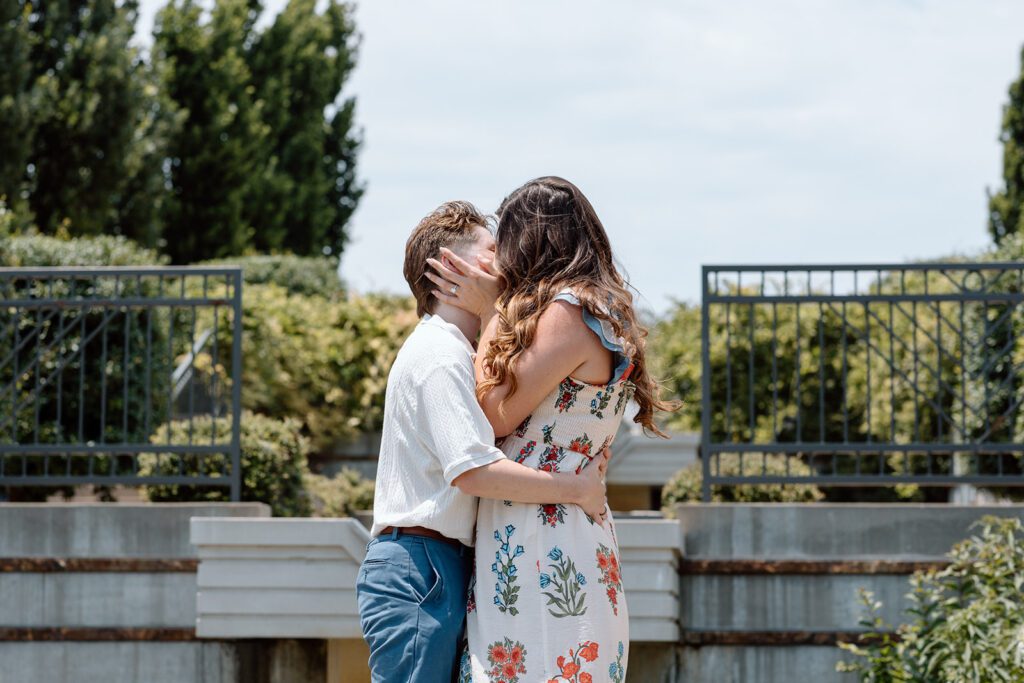 two women kissing at queer engagement at Tulsa Botanical Garden