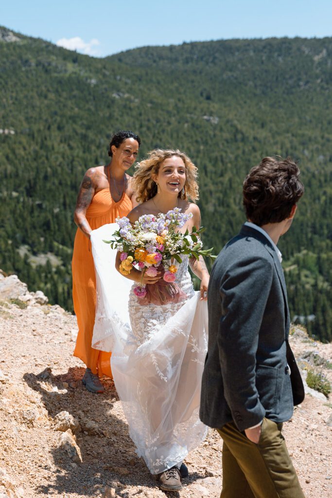 Grooms first look at St. Mary's Glacier elopement 