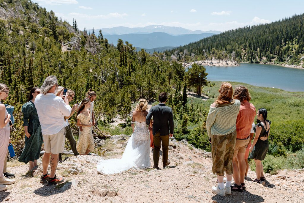 bride and groom go down the aisle at St Mary's Glacier elopement Colorado