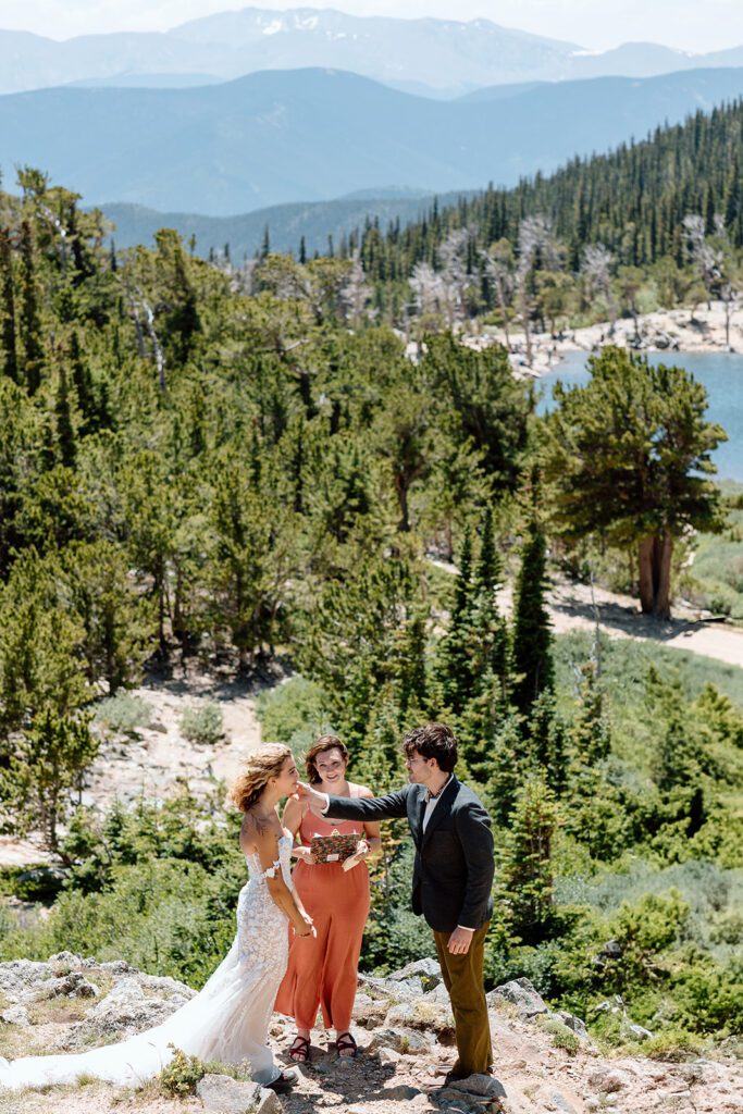 bride and groom with officiant St Mary's Glacier 