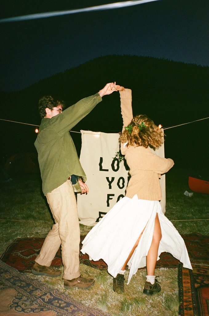bride and groom dance during reception during elopement 