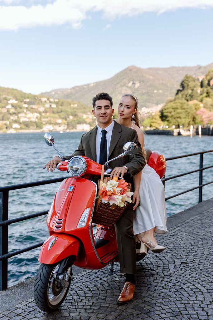 lake como elopement mixed race couple on red vespa 