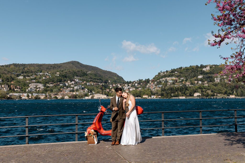 bride cuddles groom at Lake Como elopement 