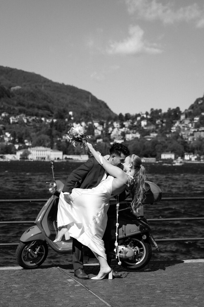 groom dips bride on Lake Como elopement black and white photo 