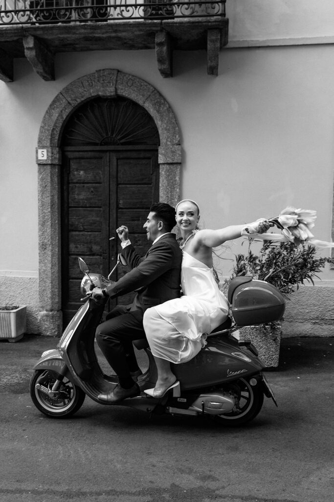 bride and groom celebrate on vespa and swing tulip bouquet 