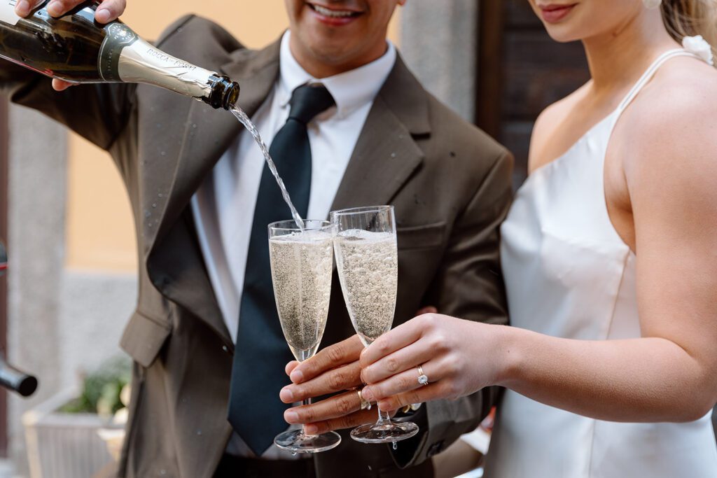 bride and groom toast elopement in Italy 