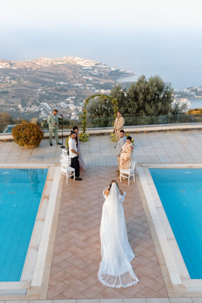 overhead shot of bride walking down the aisle in patio dream greek elopement 