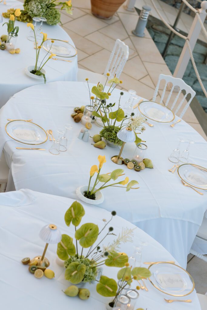 wedding table settings in patio Greek elopement with green anthuriums