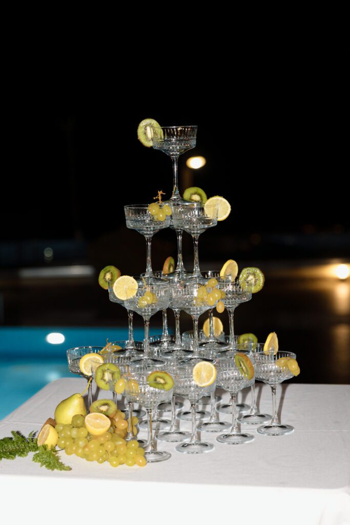 champagne tower with lemons and kiwis at greek elopement 